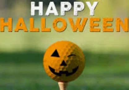A golf ball decorated as a jack-o’-lantern on a tee beneath the greeting Happy Halloween.
