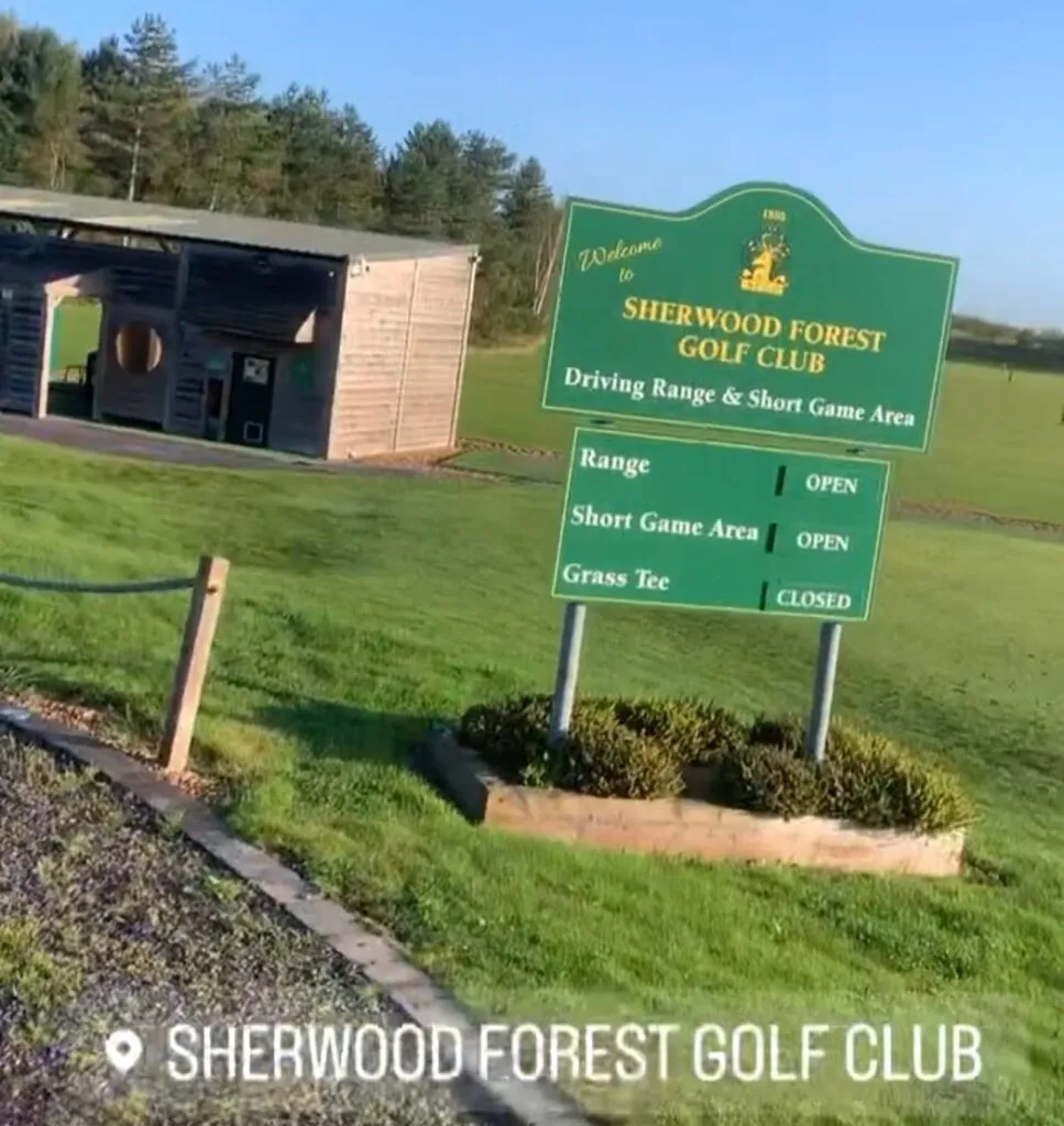 Sherwood Forest Golf Club sign beside its practice area: driving range and short game area open, grass tee closed.
